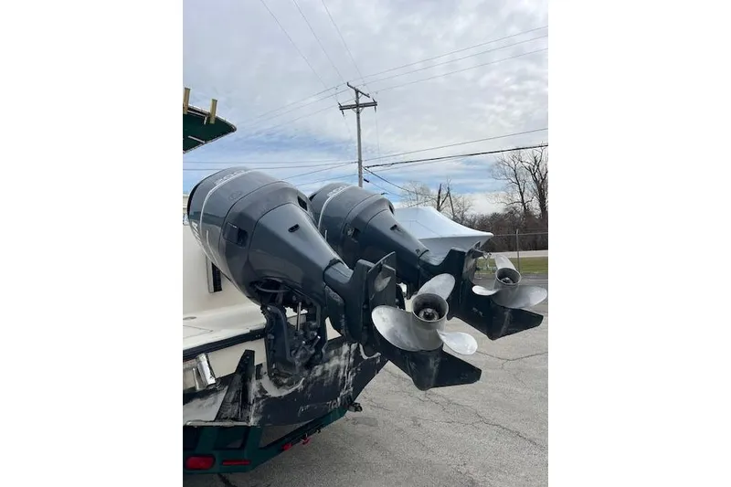 Slide: The Image of Twin outboard motors on a 2001 Pursuit 2670 Cuddy Console boat. - 15