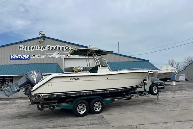 Slide: The Image of 2001 Pursuit 2670 Cuddy Console boat on trailer at Happy Days Boating Co. - 2