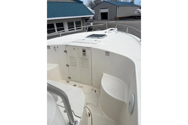 Slide: The Image of 2001 Pursuit 2670 Cuddy Console boat deck with storage compartment. - 6