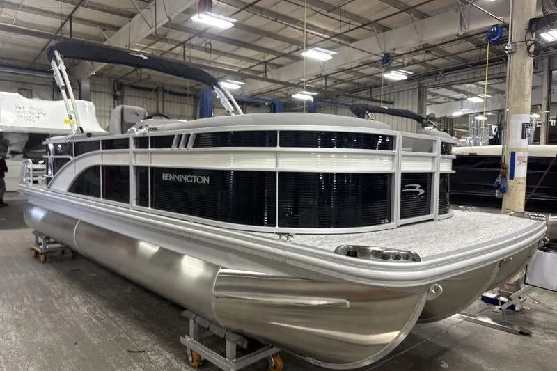 The Image of 2026 Bennington 22SXSR pontoon boat in a factory setting. - 1