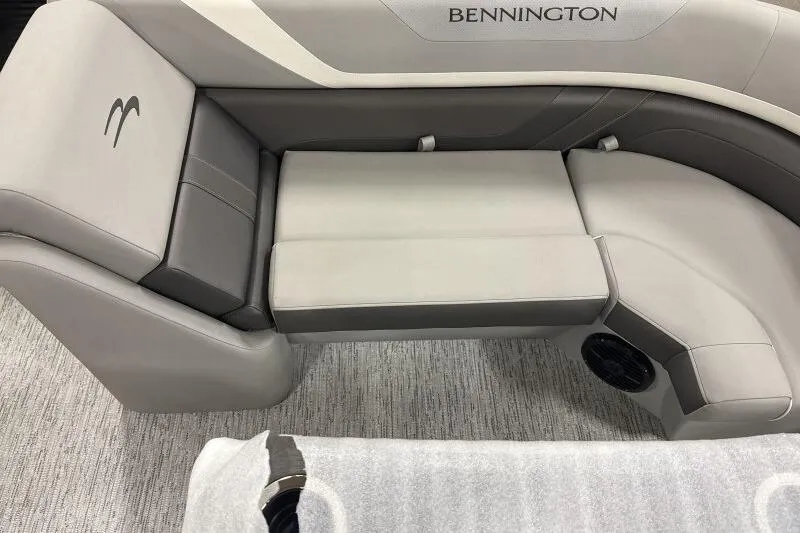 Slide: The Image of 2026 Bennington 22SXSR boat interior with gray seating and logo detail. - 10