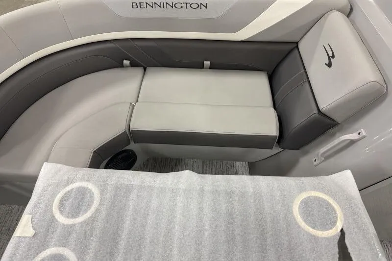 Slide: The Image of 2026 Bennington 22SXSR boat interior with gray seating and cup holders. - 11