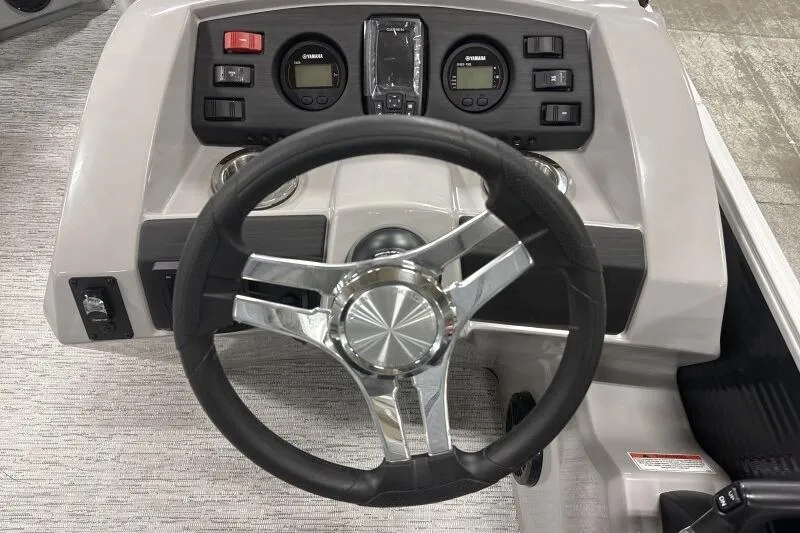 Slide: The Image of Steering console of 2026 Bennington 22SXSR boat with modern controls and gauges. - 14