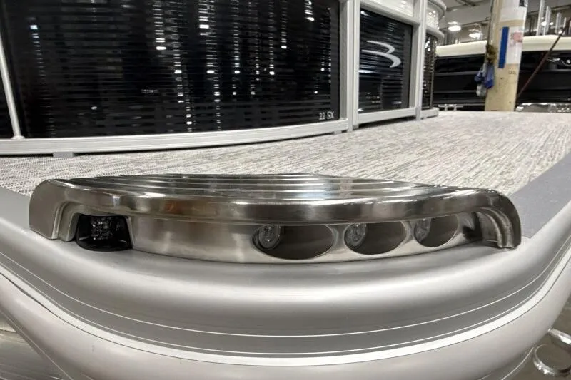 Slide: The Image of 2026 Bennington 22SXSR pontoon boat with sleek metallic detailing and modern design. - 8