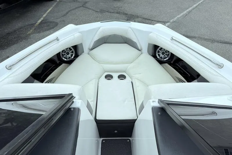 Slide: The Image of 2014 Tigé R20 boat interior with white seating and cup holders. - 10
