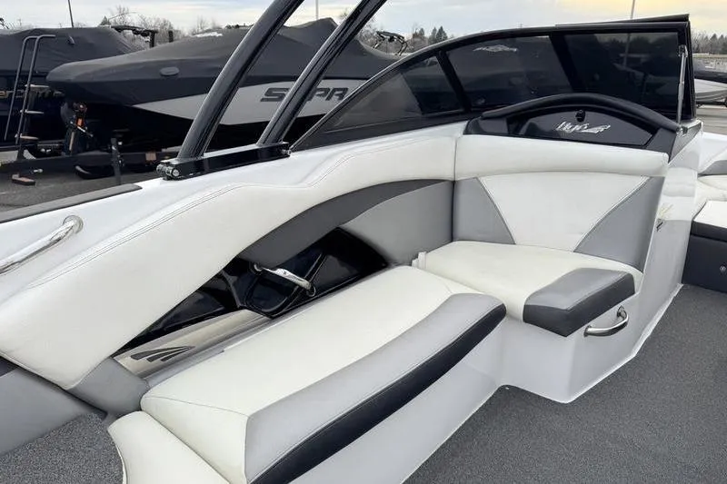 Slide: The Image of 2014 Tigé R20 boat interior with white and gray seating. - 12