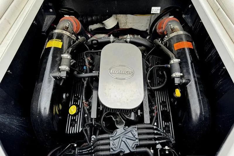 Slide: The Image of Engine compartment of a 2014 Tigé R20 boat, featuring a clean Indmar engine. - 5