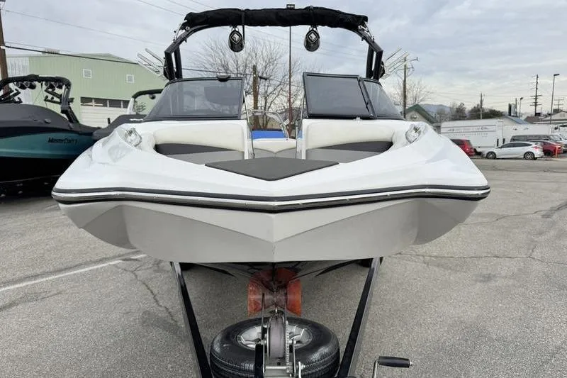 Slide: The Image of 2014 Tigé R20 boat on trailer, front view in outdoor setting. - 6