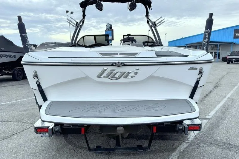 Slide: The Image of 2014 Tigé R20 boat rear view in a parking lot. - 7