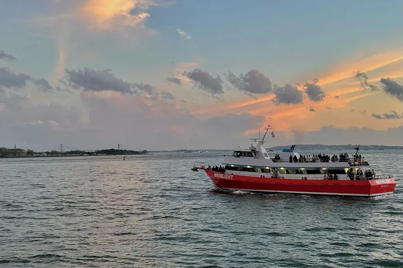 Slide: The Image of Red and white ferry "Moonlight" on water at sunset, Custom Commercial Steel 100, 1985. - 2