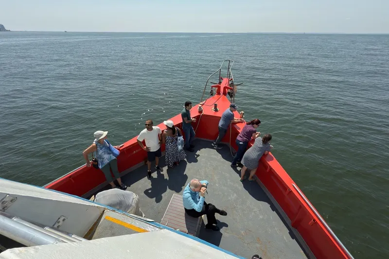 Slide: The Image of People enjoying a boat ride on the Custom Commercial Steel 100, 1985 model. - 6