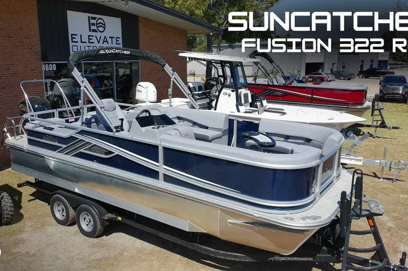 The Image of 2025 SunCatcher Fusion 324SS pontoon boat displayed at dealership, featuring sleek design. - 0