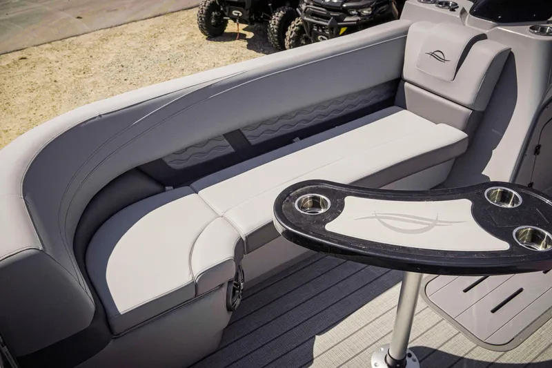 Slide: The Image of Luxurious seating area on 2025 SunCatcher Fusion 324SS pontoon boat with stylish table. - 15