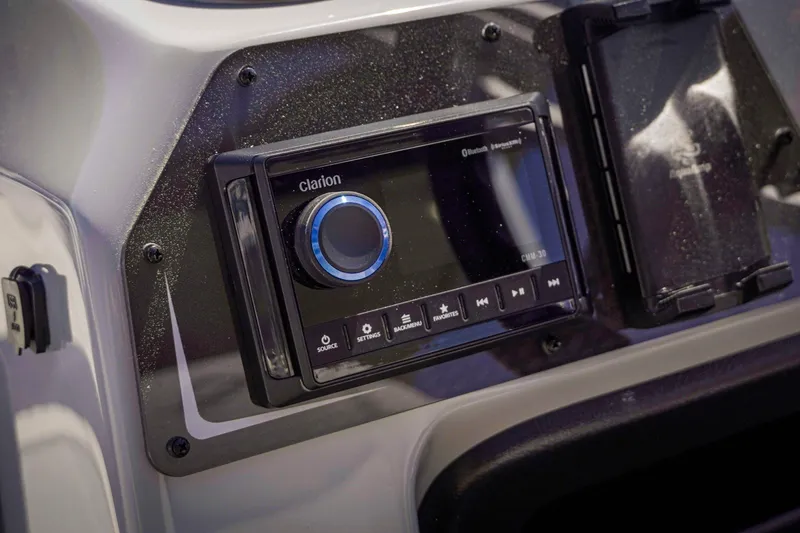 Slide: The Image of Dashboard of 2025 SunCatcher Fusion 324SS featuring a Clarion audio system. - 21