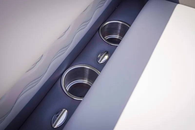 Slide: The Image of Cup holders in 2025 SunCatcher Fusion 324SS boat interior. - 25