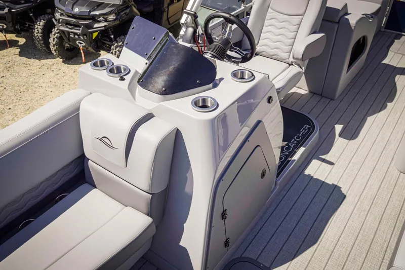 Slide: The Image of Interior of 2025 SunCatcher Fusion 324SS boat with modern seating and steering console. - 28