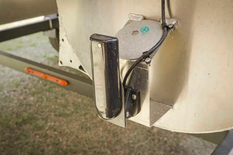 Slide: The Image of Close-up of SunCatcher Fusion 324SS 2025 boat component with wiring and metal bracket. - 32