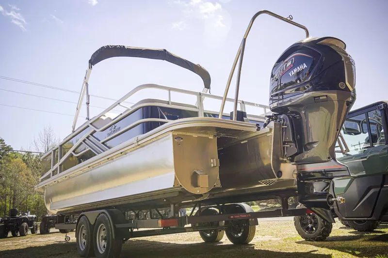 Slide: The Image of 2025 SunCatcher Fusion 324SS pontoon boat on trailer with Yamaha outboard motor. - 4