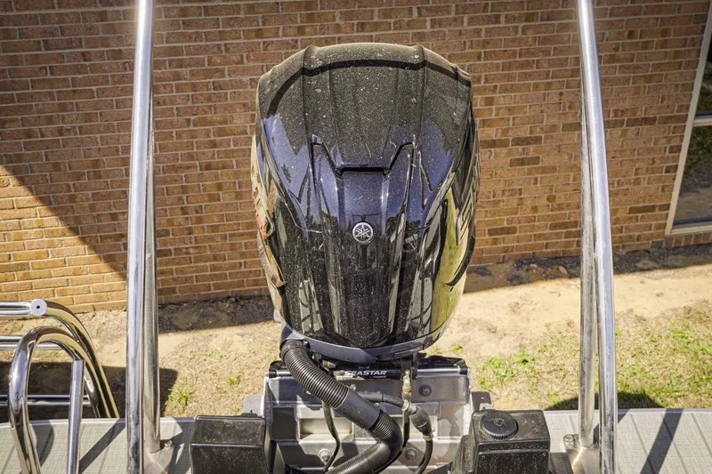 Slide: The Image of 2025 SunCatcher Fusion 324SS boat engine, close-up view, outdoors. - 6