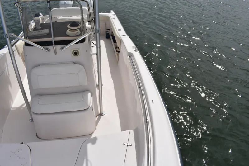 Slide: The Image of 2001 Grady-White Advance 247 boat on water, featuring white seating and console. - 13