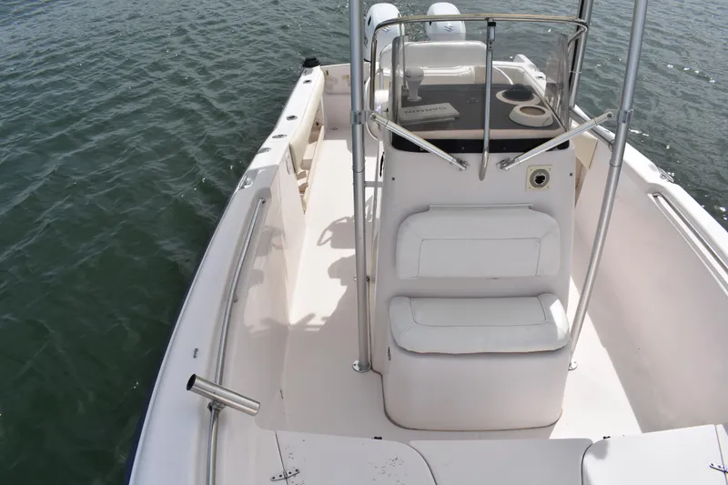 Slide: The Image of 2001 Grady-White Advance 247 boat interior with seating and console on calm water. - 14