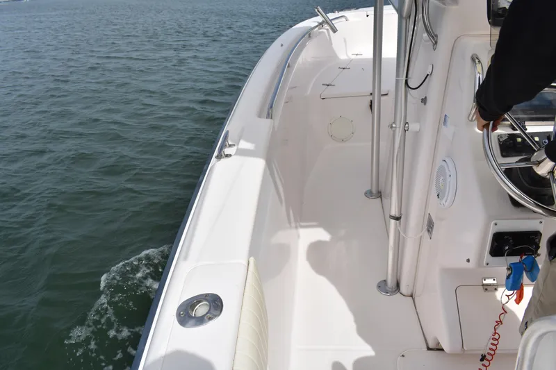 Slide: The Image of 2001 Grady-White Advance 247 boat navigating on open water. - 16