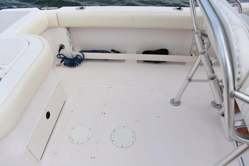 Slide: The Image of 2001 Grady-White Advance 247 boat interior with seating and storage compartments. - 17