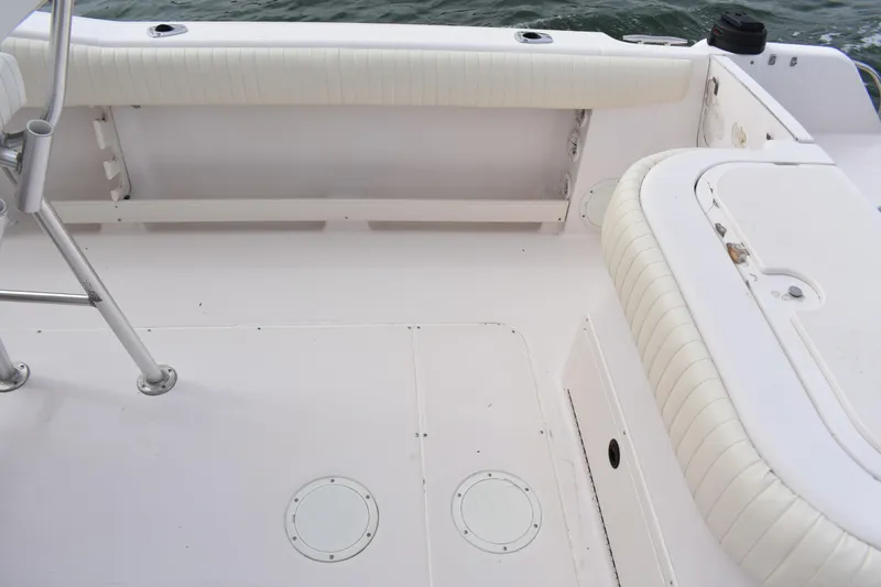 Slide: The Image of 2001 Grady-White Advance 247 boat interior with white seating and deck details. - 18