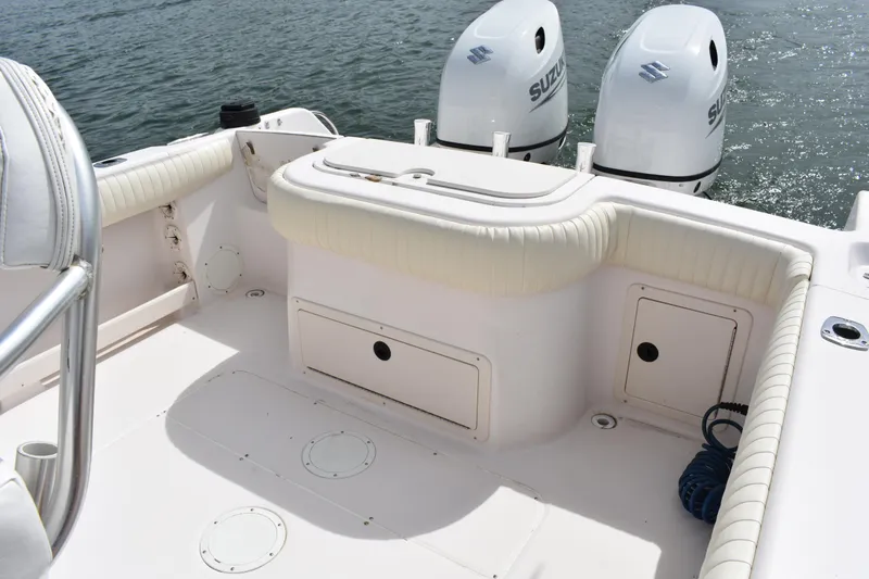 Slide: The Image of 2001 Grady-White Advance 247 boat interior with twin Suzuki outboard motors. - 19