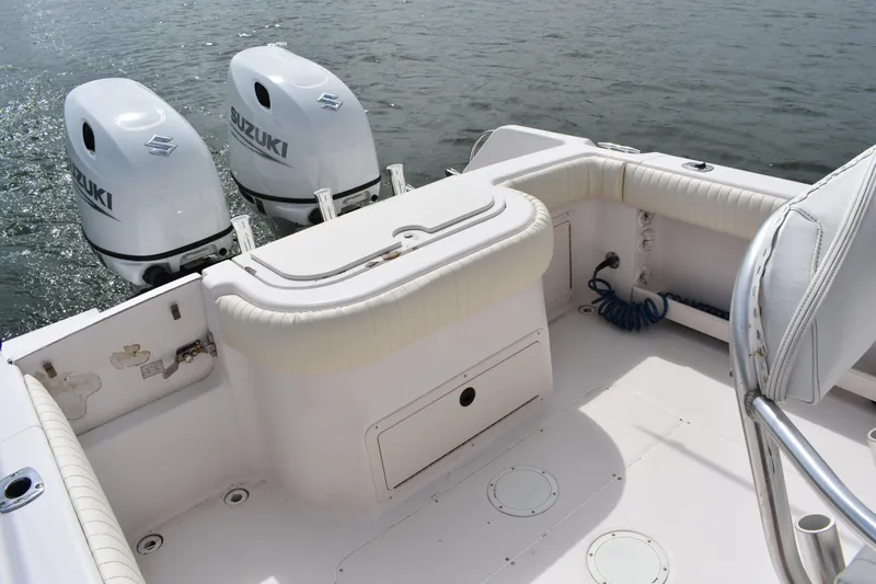 Slide: The Image of 2001 Grady-White Advance 247 boat with twin Suzuki outboard motors on water. - 20