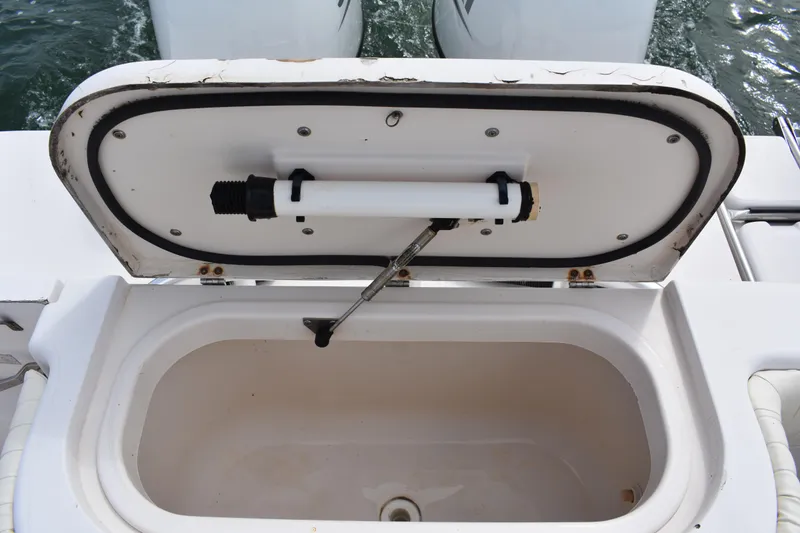 Slide: The Image of Open storage compartment on a 2001 Grady-White Advance 247 boat. - 21