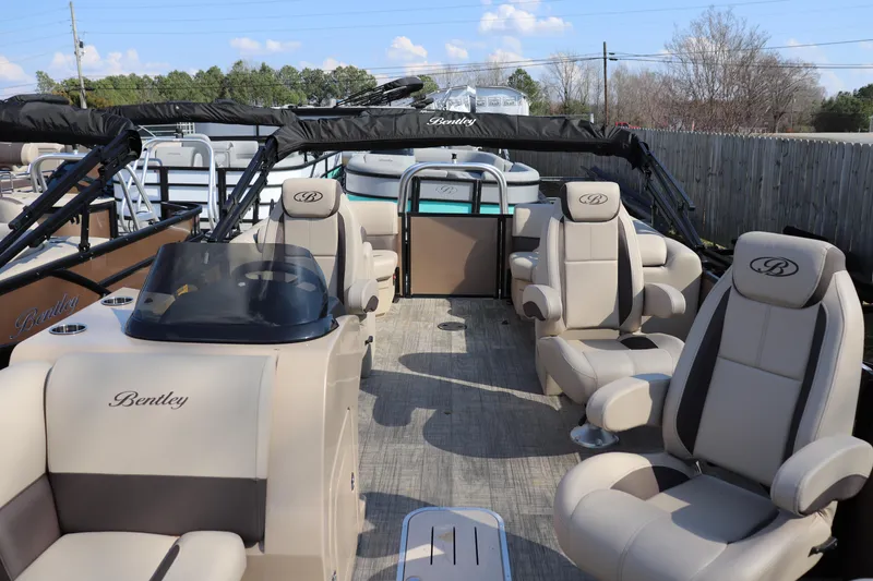 Slide: The Image of 2026 Bentley Pontoons Legacy 223 DL Navigator with luxurious seating and sleek design. - 1