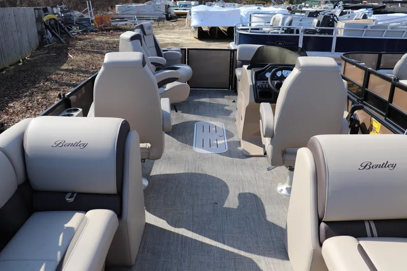 Slide: The Image of 2026 Bentley Pontoons Legacy 223 DL Navigator interior with luxurious seating and modern design. - 10