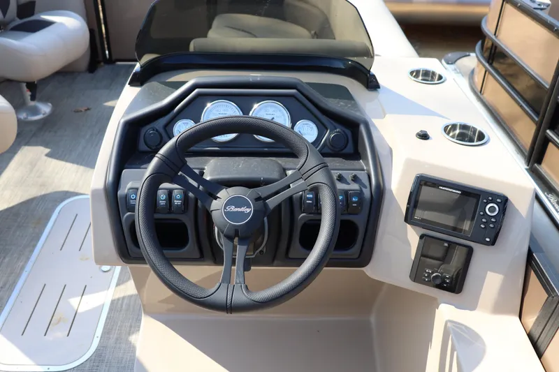 Slide: The Image of Steering console of 2026 Bentley Pontoons Legacy 223 DL Navigator with gauges and controls. - 6