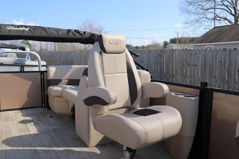 Slide: The Image of 2026 Bentley Pontoons Legacy 223 DL Navigator interior with luxurious seating and modern design. - 7