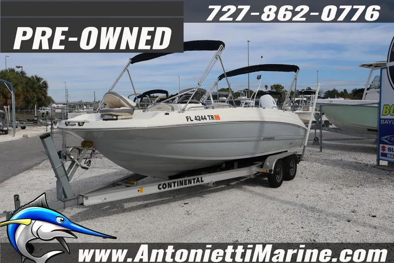 The Image of Pre-owned 2023 Stingray 212 SC boat on trailer at Antonietti Marine dealership. - 1