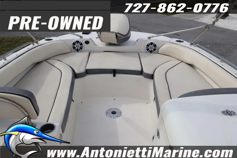 Slide: The Image of Pre-owned 2023 Stingray 212 SC boat interior with cushioned seating, available at Antonietti Marine. - 12