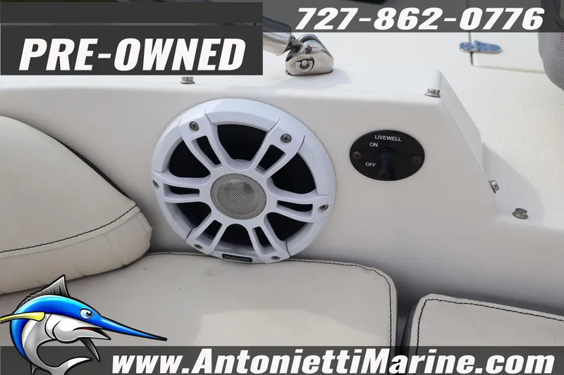 Slide: The Image of Pre-owned 2023 Stingray 212 SC boat interior with speaker and livewell switch. - 14
