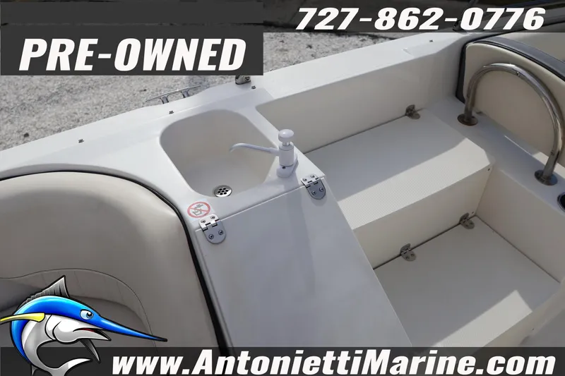 Slide: The Image of Pre-owned 2023 Stingray 212 SC boat interior with sink, available at Antonietti Marine. - 27