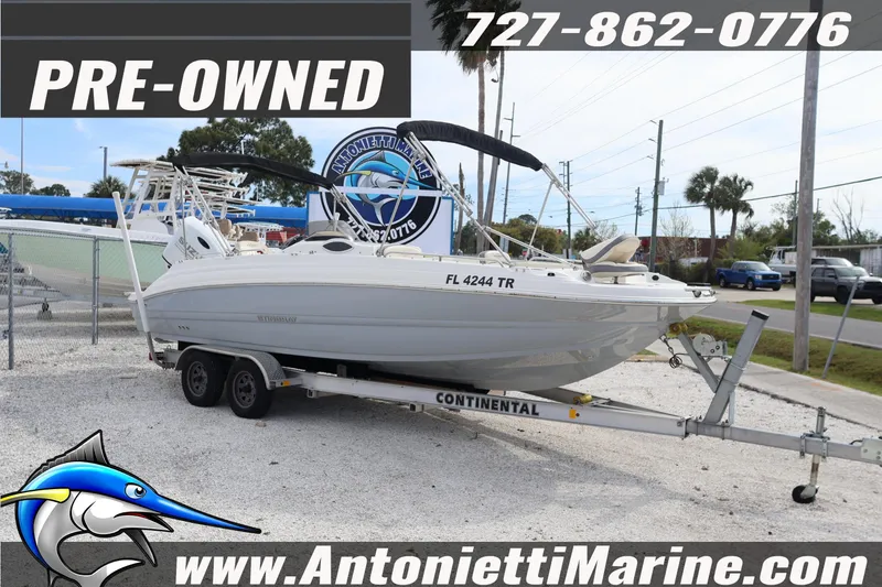 Slide: The Image of Pre-owned 2023 Stingray 212 SC boat on trailer at Antonietti Marine dealership. - 3