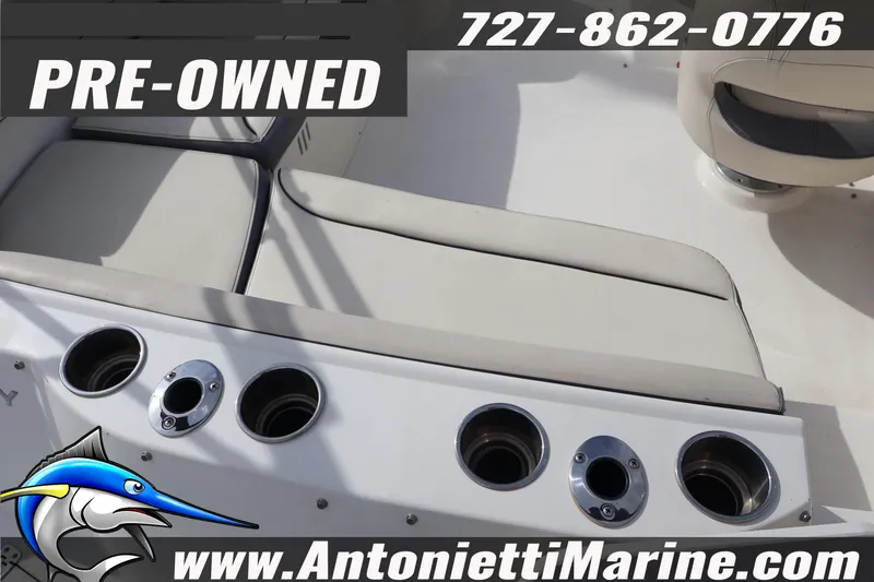 Slide: The Image of Pre-owned 2023 Stingray 212 SC boat interior with seating and cup holders. - 33