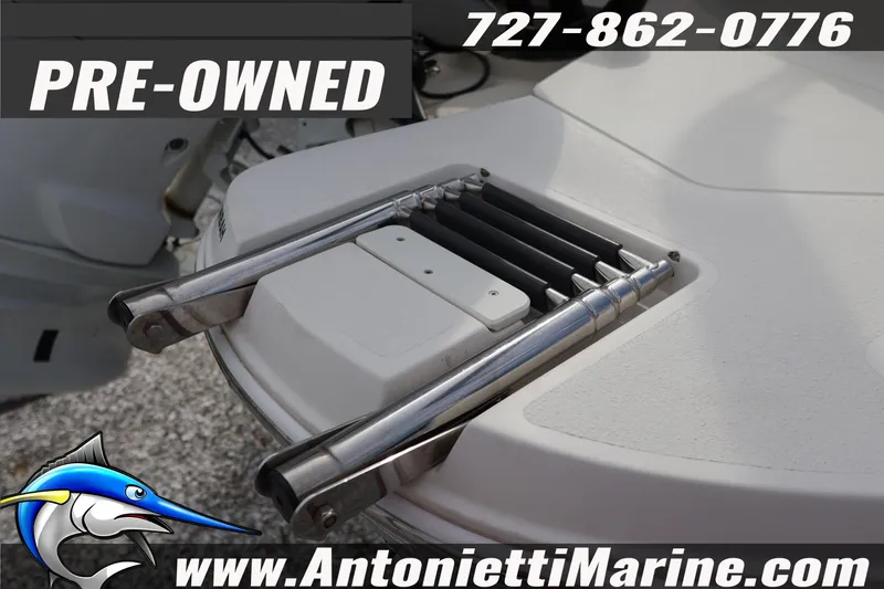 Slide: The Image of Pre-owned 2023 Stingray 212 SC boat with foldable ladder, contact Antonietti Marine. - 9