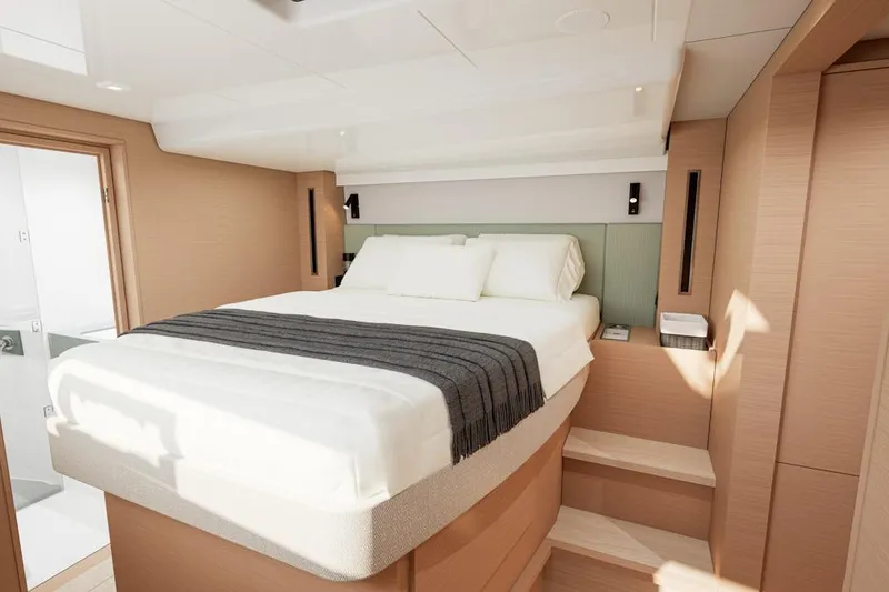 Slide: The Image of Luxurious bedroom in Lagoon 47 catamaran, model year 2026. - 12