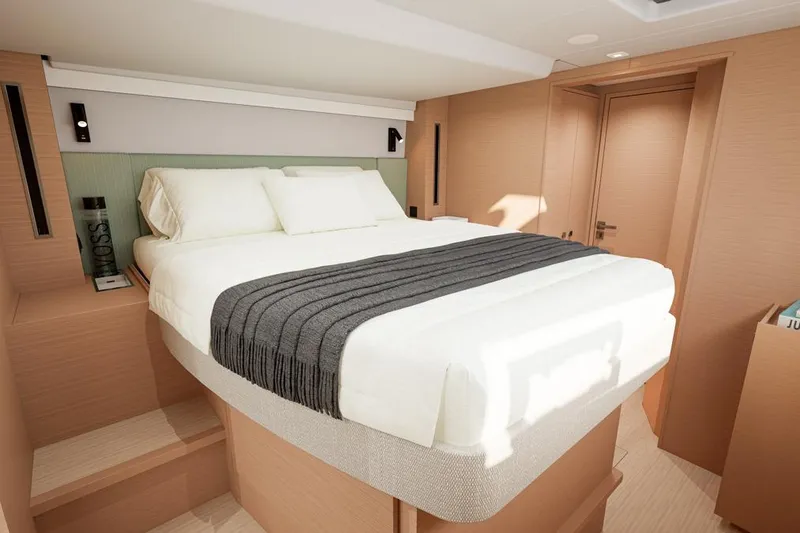 Slide: The Image of Luxurious bedroom in Lagoon 47 catamaran, model year 2026. - 13