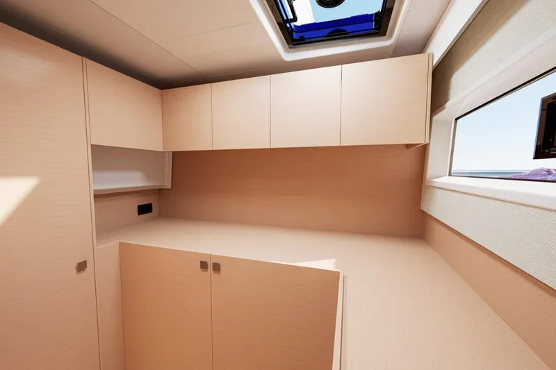 Slide: The Image of Interior of Lagoon 47 yacht, 2026 model, featuring modern wooden cabinetry. - 14