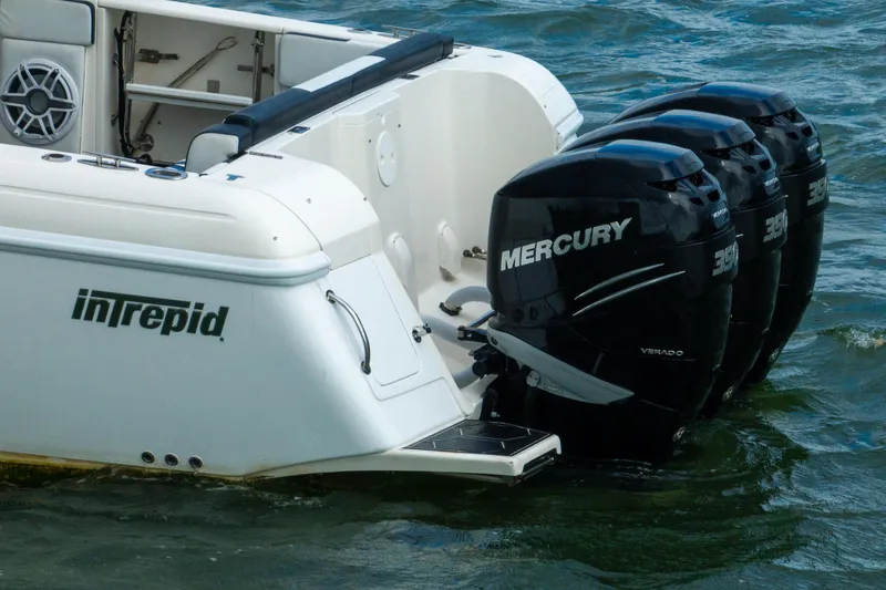 Slide: The Image of 2008 Intrepid 390 Sport Yacht with triple Mercury outboard engines on water. - 12