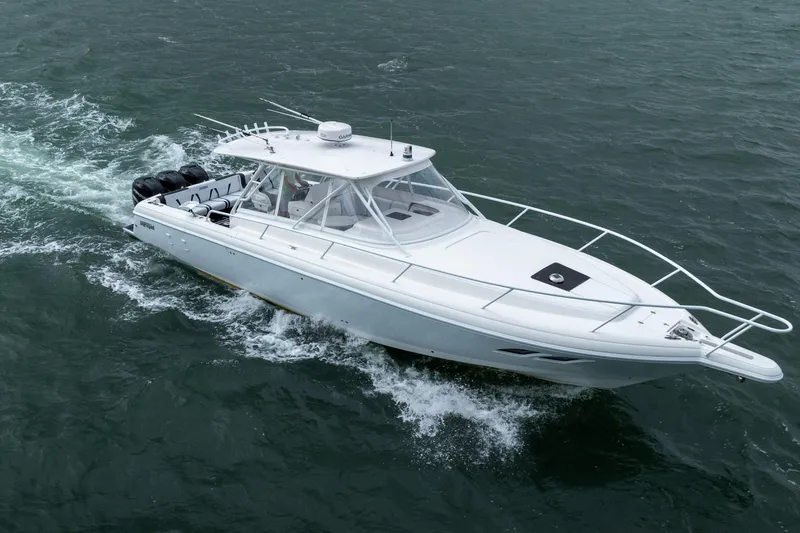 Slide: The Image of 2008 Intrepid 390 Sport Yacht cruising on open water. - 13