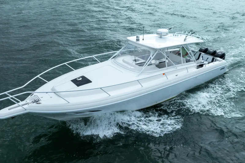 Slide: The Image of 2008 Intrepid 390 Sport Yacht cruising on open water. - 14