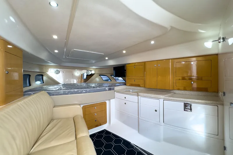 Slide: The Image of Interior of 2008 Intrepid 390 Sport Yacht with modern cabinetry and seating. - 15