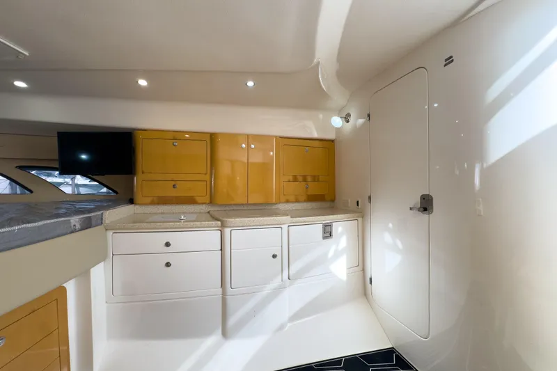 Slide: The Image of Interior of 2008 Intrepid 390 Sport Yacht with modern cabinetry and sleek design. - 19